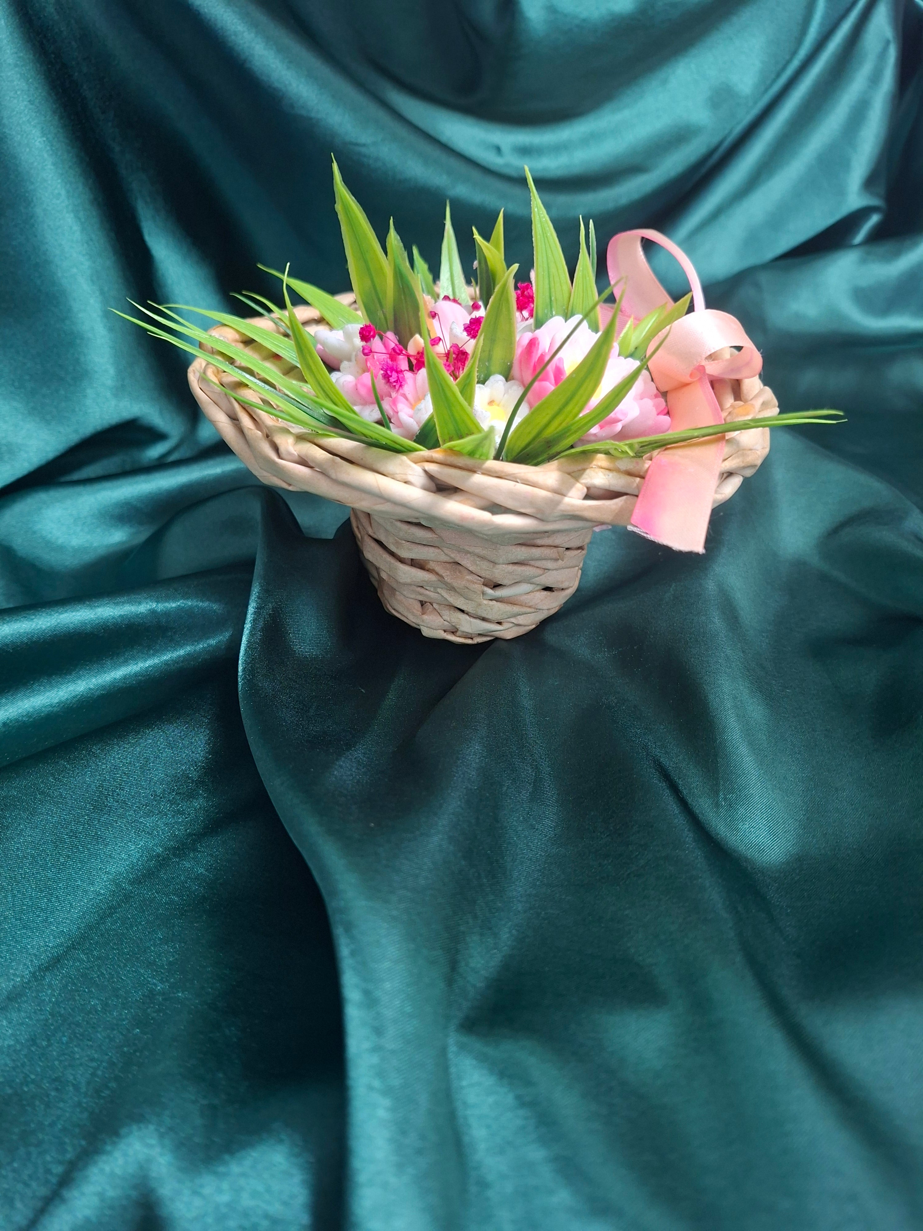 Artificial Flowering Plant In Woven Basket With Pink Ribbon Decor