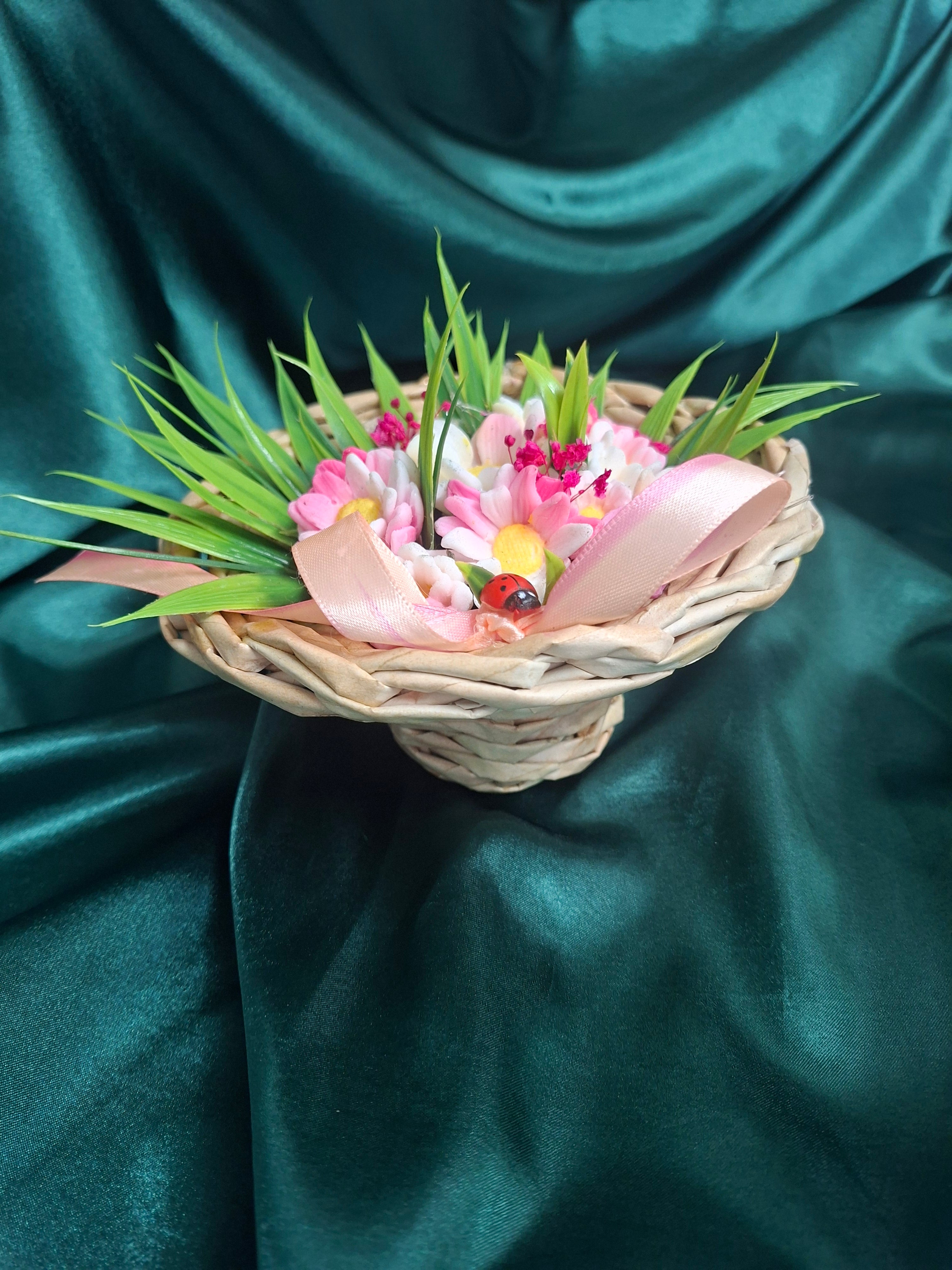 Artificial Flowering Plant In Woven Basket With Pink Ribbon Decor