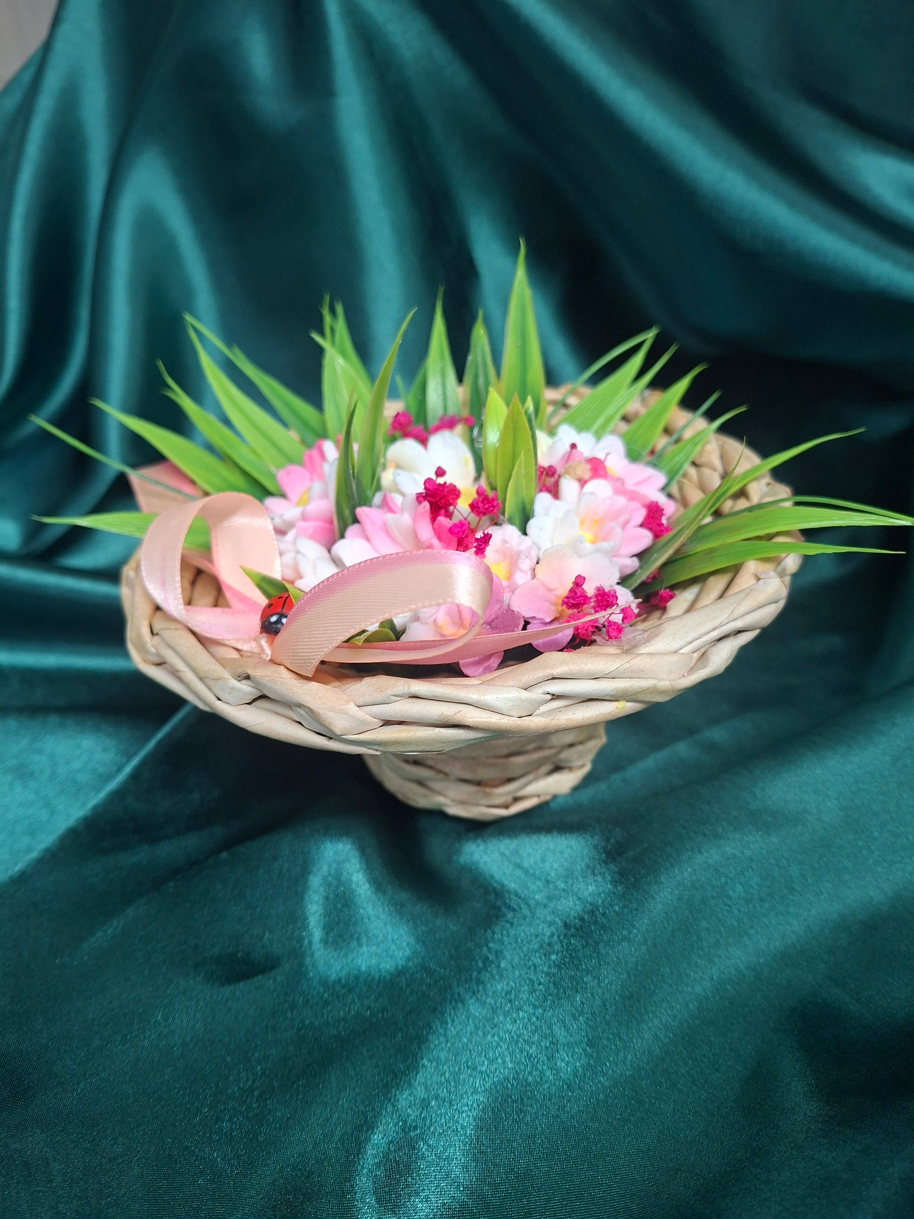 Artificial Flowering Plant In Woven Basket With Pink Ribbon Decor
