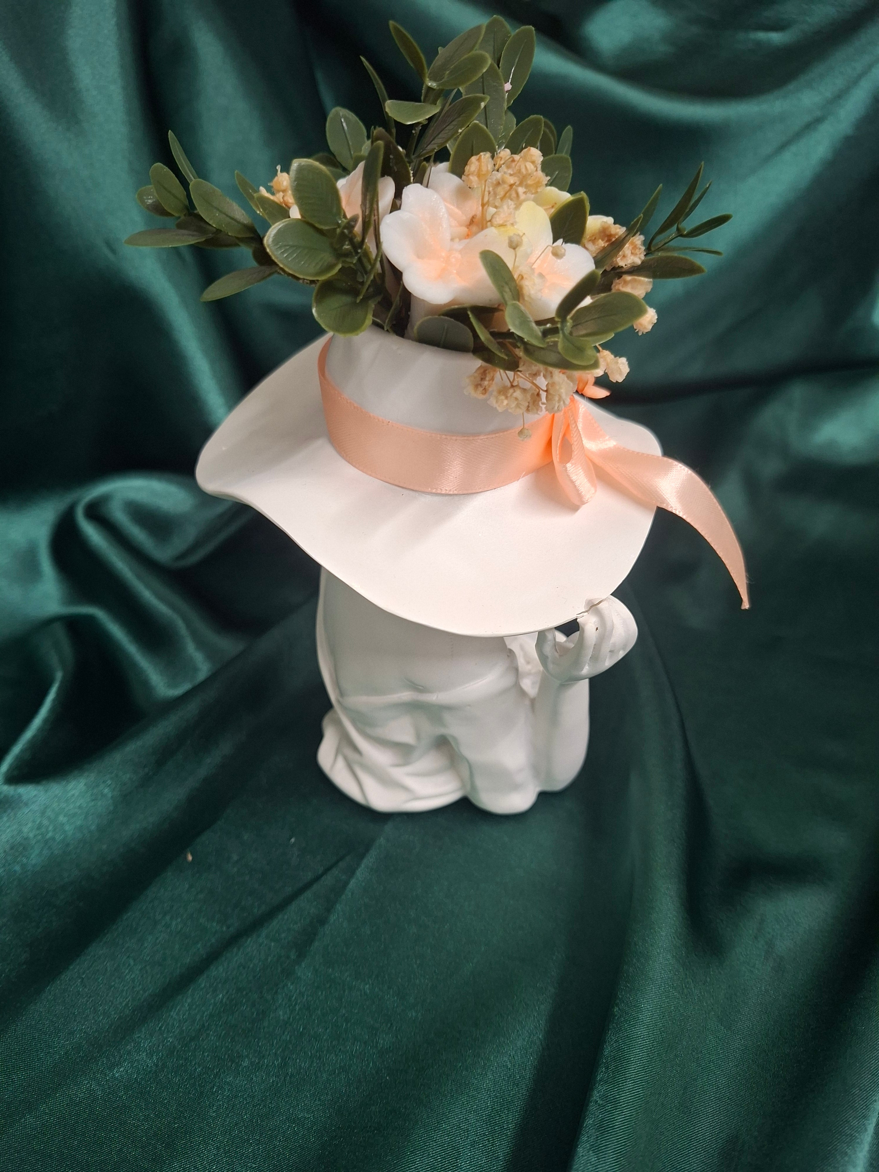 Elegant Artificial Floral Hat Display With Peach Ribbon Accent