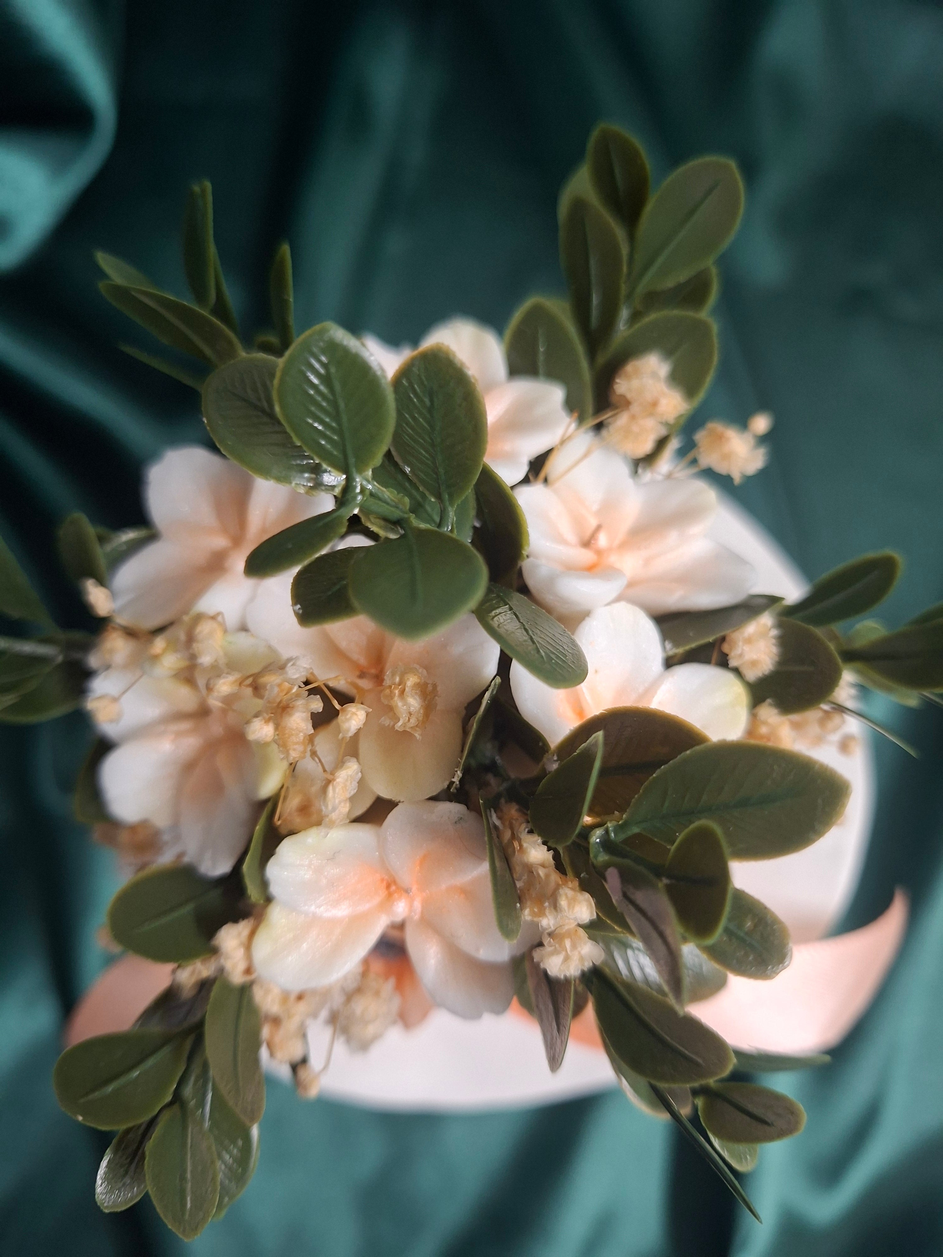 Elegant Artificial Floral Hat Display With Peach Ribbon Accent