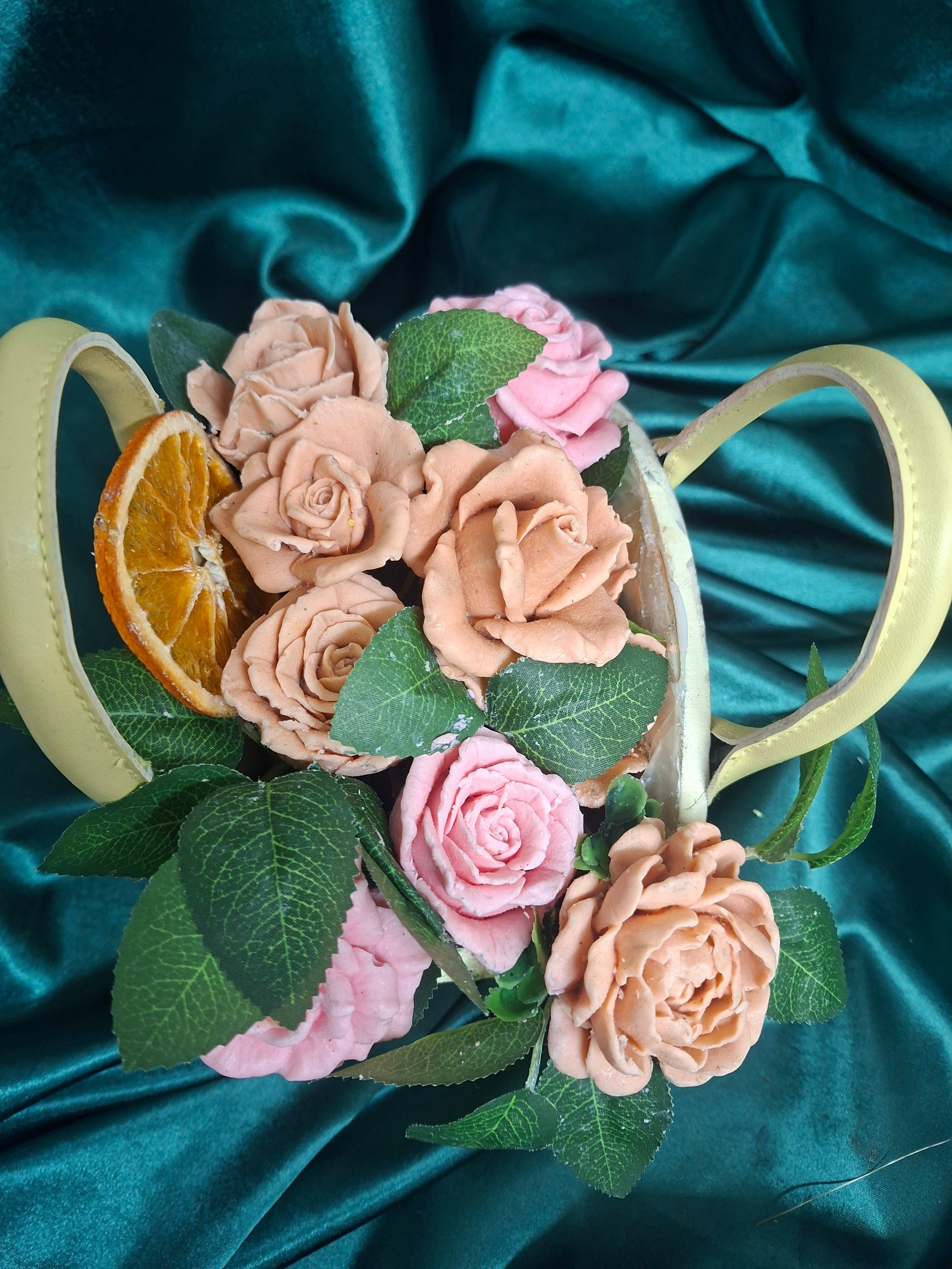 Woven Floral Basket With Pink Peach Artificial Roses And Green Leaves