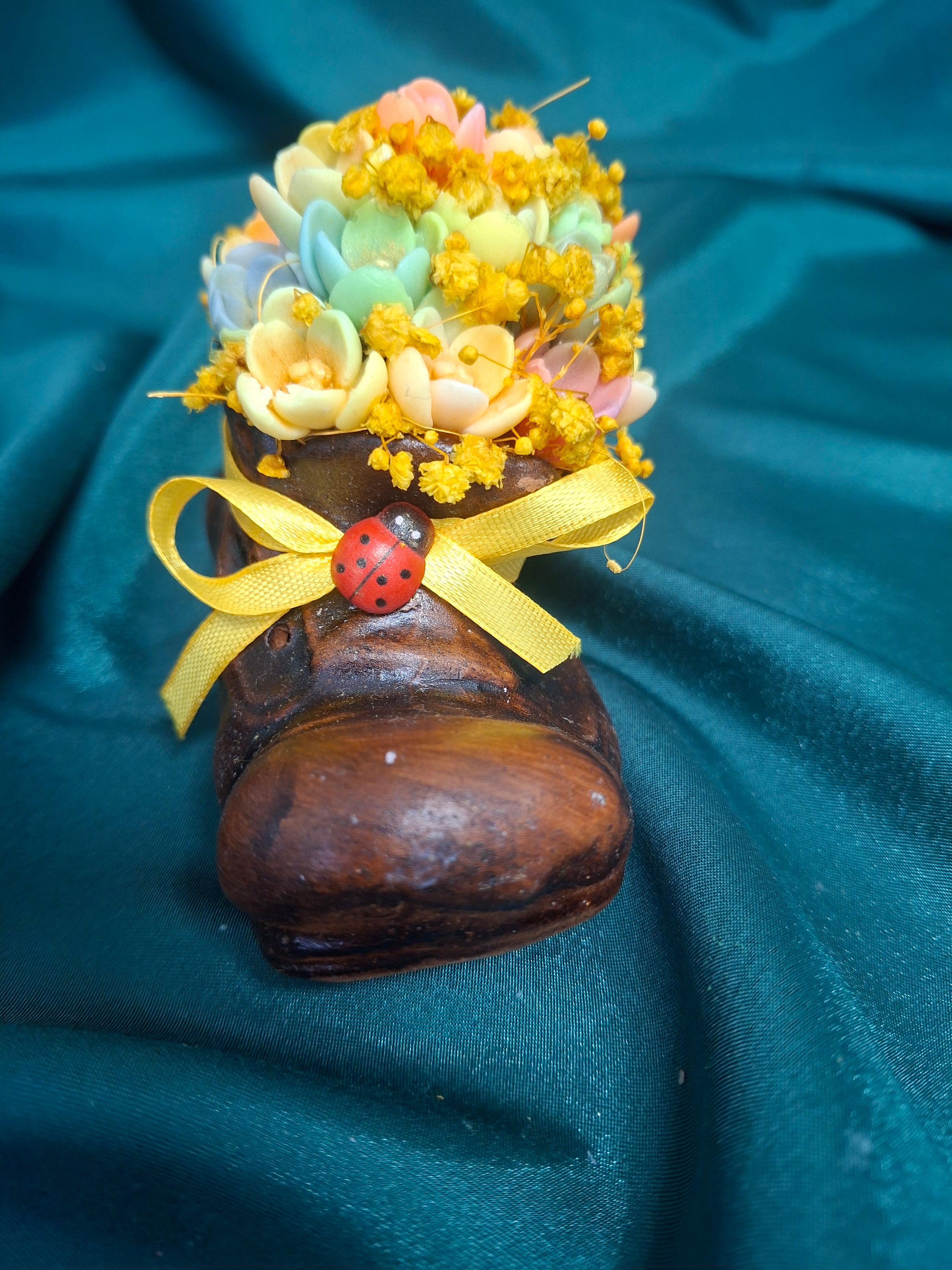 Artificial Flower Bouquet in Rustic Boot Vase with Yellow Ribbon